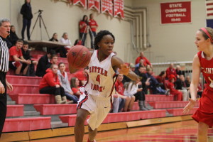 Kiera Washpun '14 drives to the basket during the substate semi-final game against Clinton. Photo by Ryan Young.