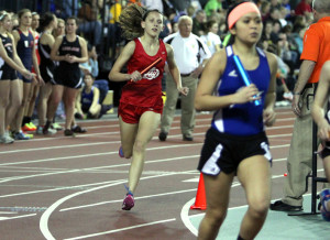 Olivia Parrott '16 runs during the team's first indoor home meet.  Photo by Annika Wasson