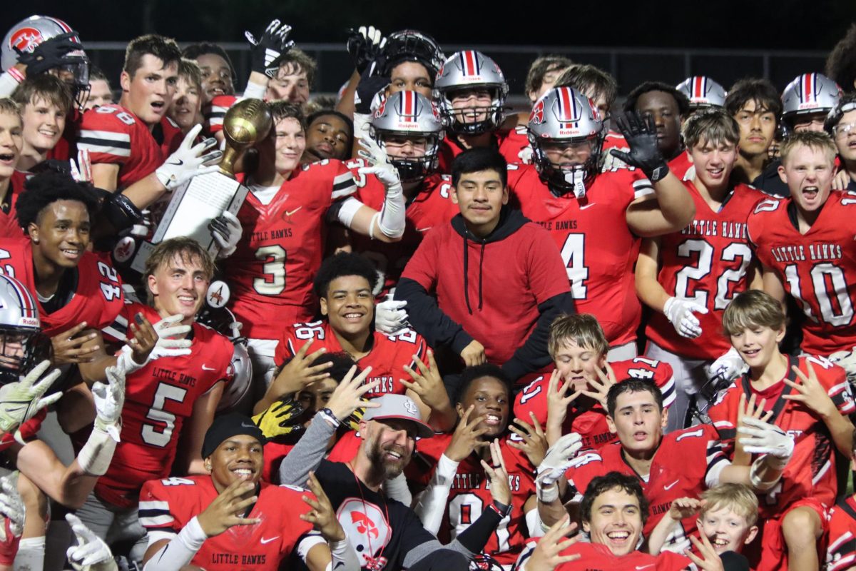 The City High team poses together after their dominant 53-14 victory in the Cy-Hawk game.