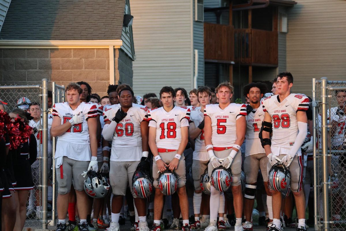 City High awaits the National Anthem before their game vs West High 