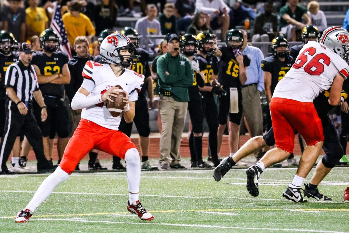 Bobby Bacon drops back to throw against Kennedy.  Bacon '24 has completed two passes for two point conversations on back to back weeks for one point victories. 