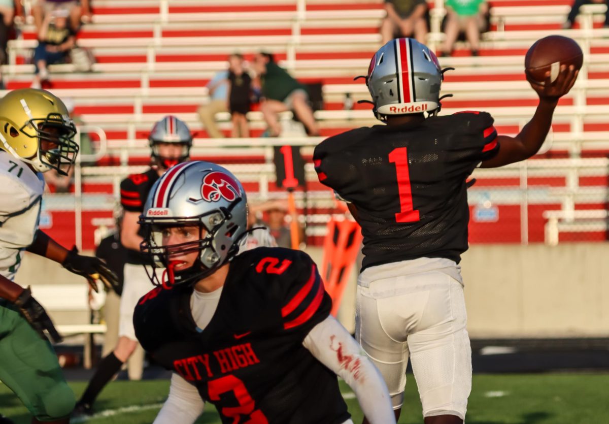 Chris Kabaiza (1) throws the ball to his wide receiver against West High.