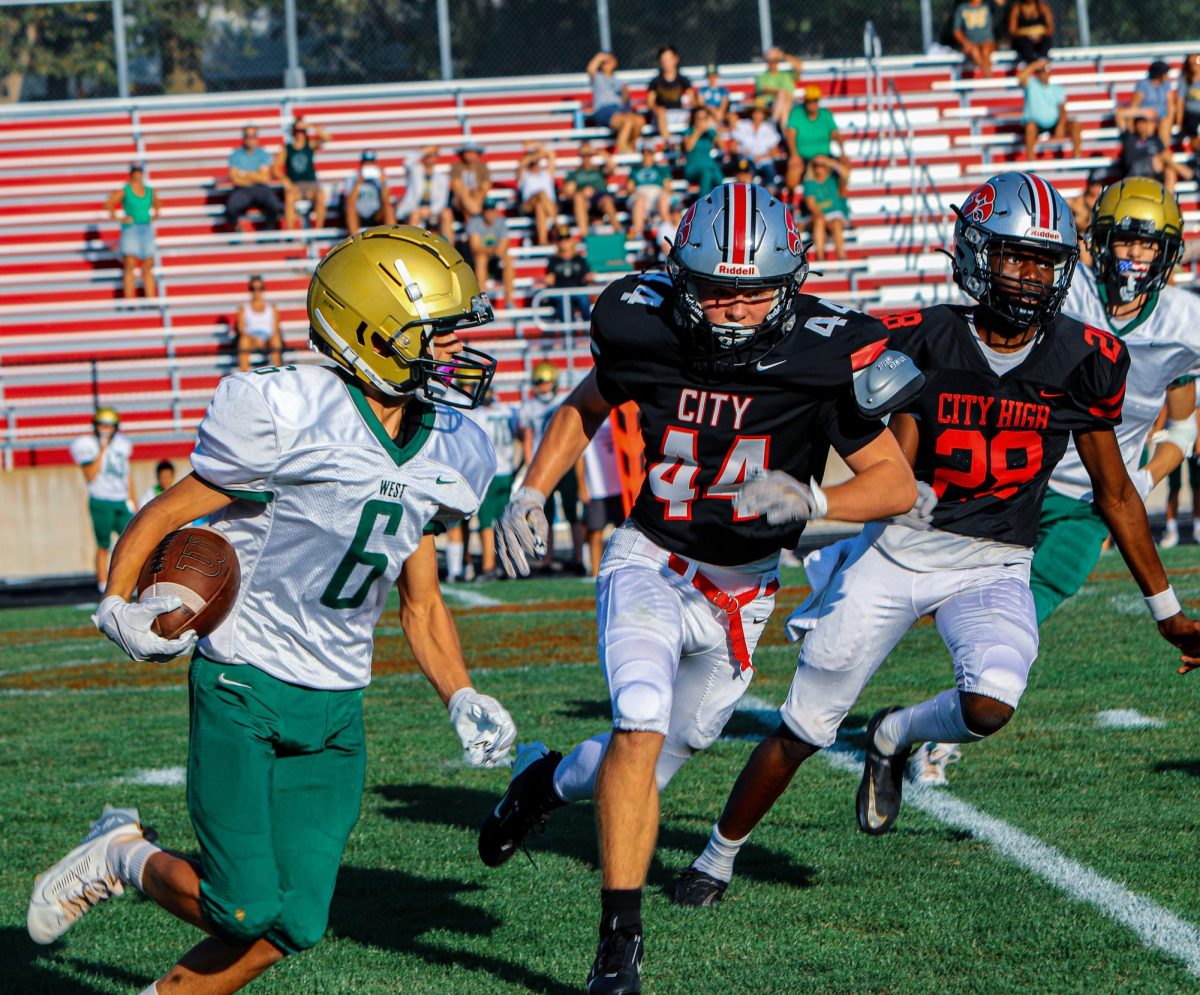 West High's receivers tailed and pursued down City High's Defense linemen '44