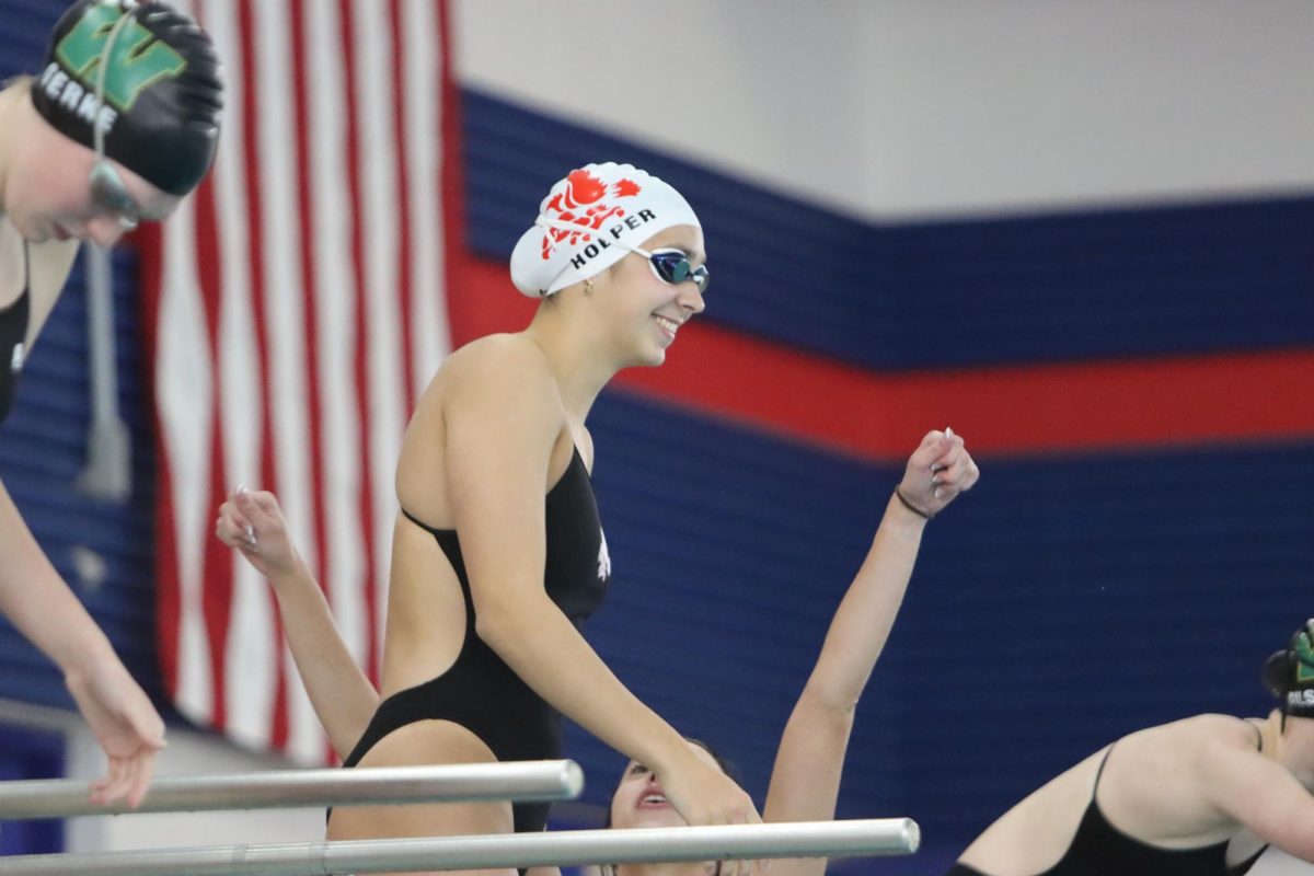 Grace Hoeper '25 gets ready to start her first race at the City vs West duel with a big smile.