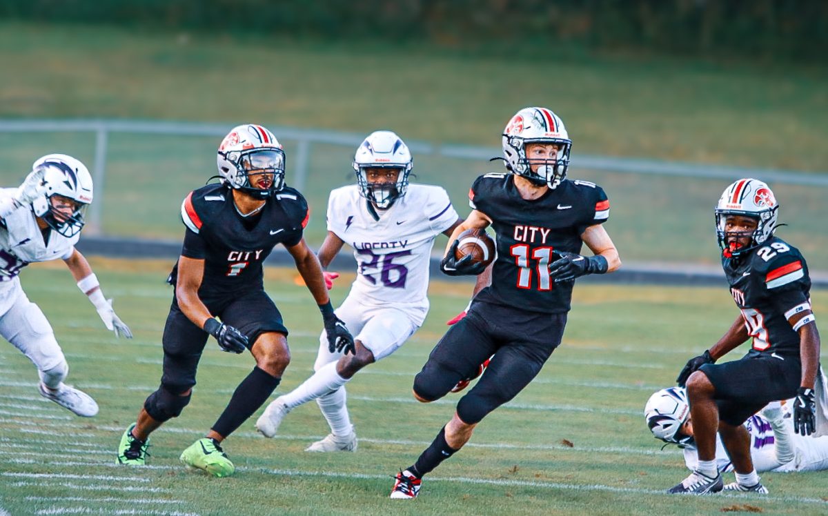 Wide receiver Connor Cross splits through the Liberty defense.