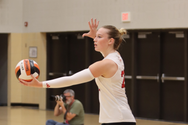 Emmy McComas '25 prepares to serve against Des Moines Valley in the 2023 Class 5A Region 6 championship game. 