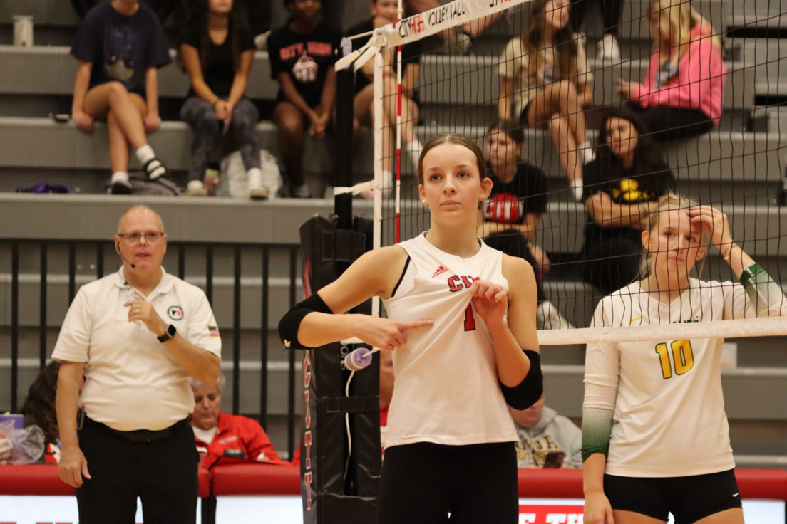 Hazel Schluckebier '28 signals to her teammates during a game against Dubuque Hempstead