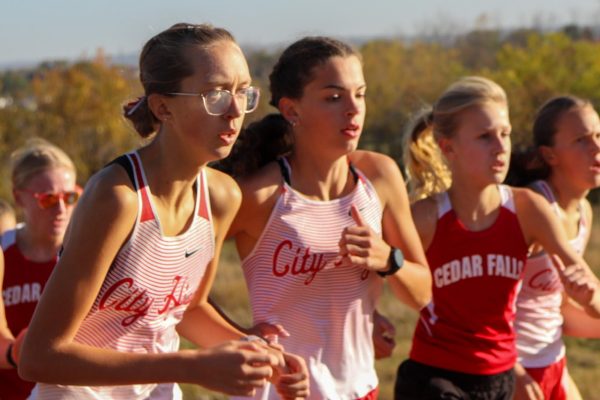 Calissa Fruin '28 and Eliza Doster '28 race together. Fruin finished 19th and Doster finished 12th with times of 19:44 and 19:17.