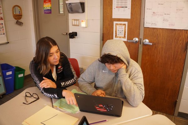 Ms. Sotillo helps a student during her class' weekly Advisory time.