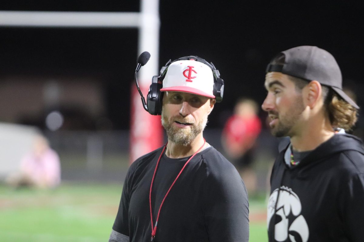 Mitch Moore discussing the game plan against Davenport North.