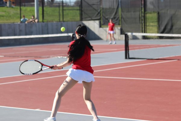 Layla Lovan '25 returns the ball to her teammate during warmups in the 2024 season.