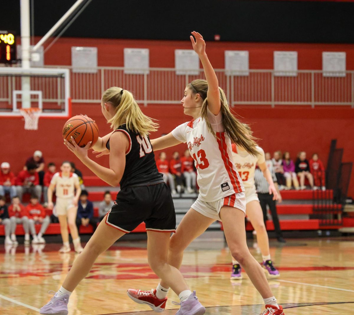 Tessa Driscoll '26 blocks her opponent from passing to their teammate