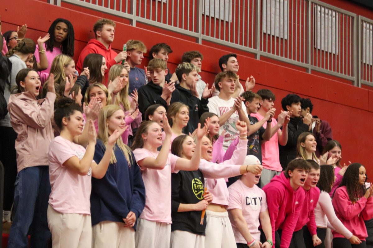 The City High pink out themed student section celebrates during the thrilling 4th quarter