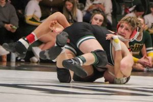 Kendall Kurtz '25 fights through a scramble. He won his match 9-5 to the 7th ranked wrestler.