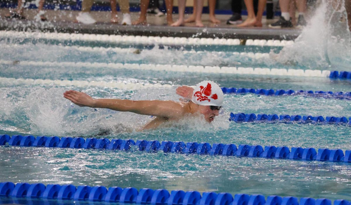 City High swimmer races to the finish line in the 100Y butterfly