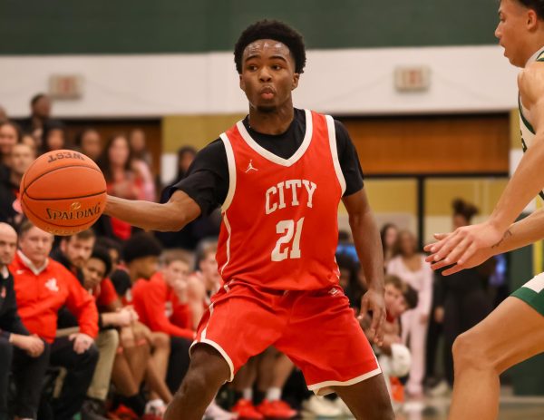 Davion Luckett '26 makes a bounce pass in the first City High vs. West High basketball game of this season.