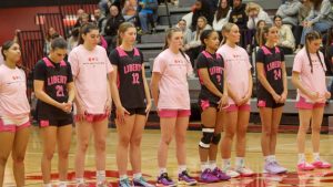 City High stands with Liberty High at their annual Mental Health Awareness Game. 