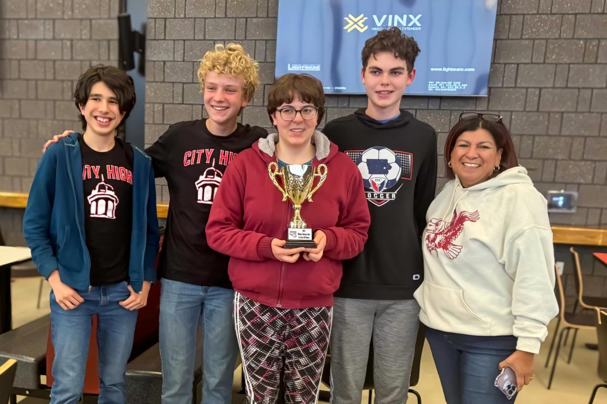 Dubuque Open Quiz Bowl champions Nicolas Vergara-Vanegas, Felix Cook, Ela Pierce, Ethan Lalumiere, and Coach Dolores Silva.