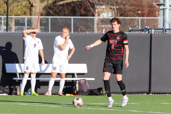 Jackson Lindsey '25 looks up the field before serving in a free kick   