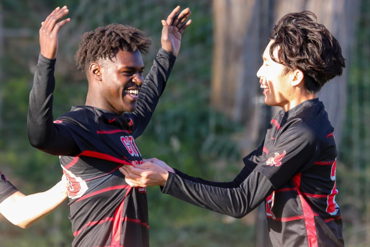 Wagdi Darya '26 celebrates the opening goal of the game with his teammates. Darya scored one of two goals for City against Liberty. 